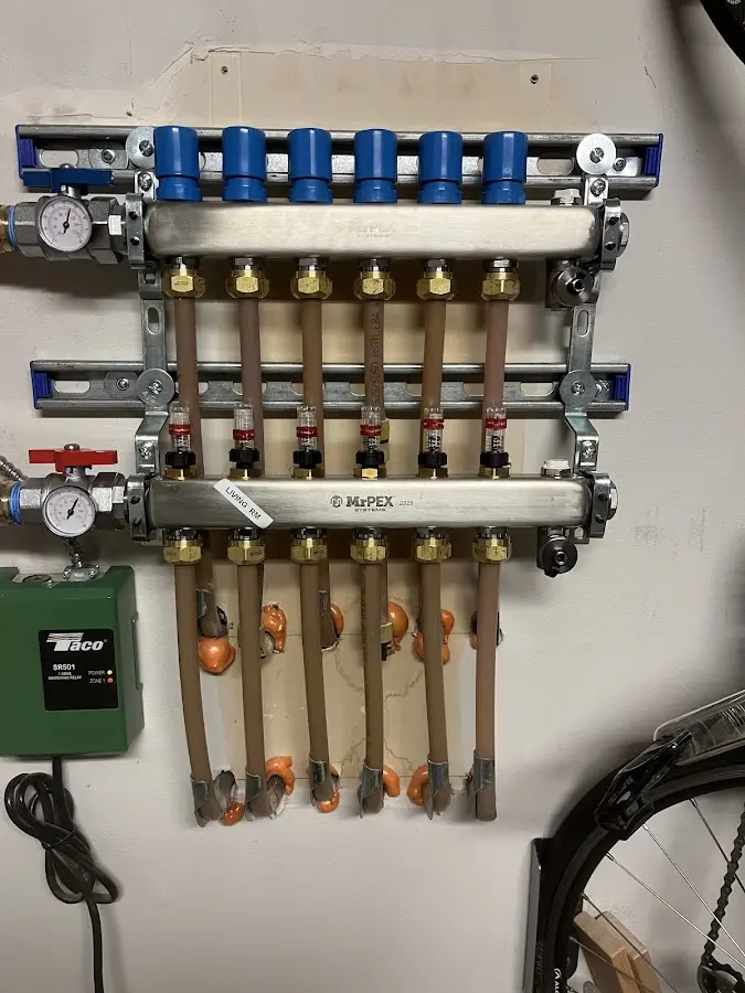 Plumber performing Water Heater Repair at a residential property in Torrington